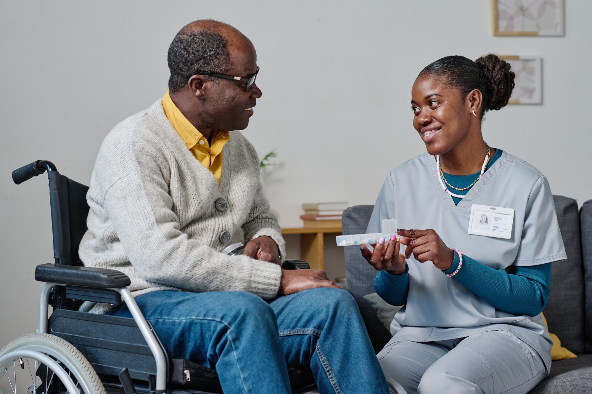 Nurse assisting senior in a wheelchair